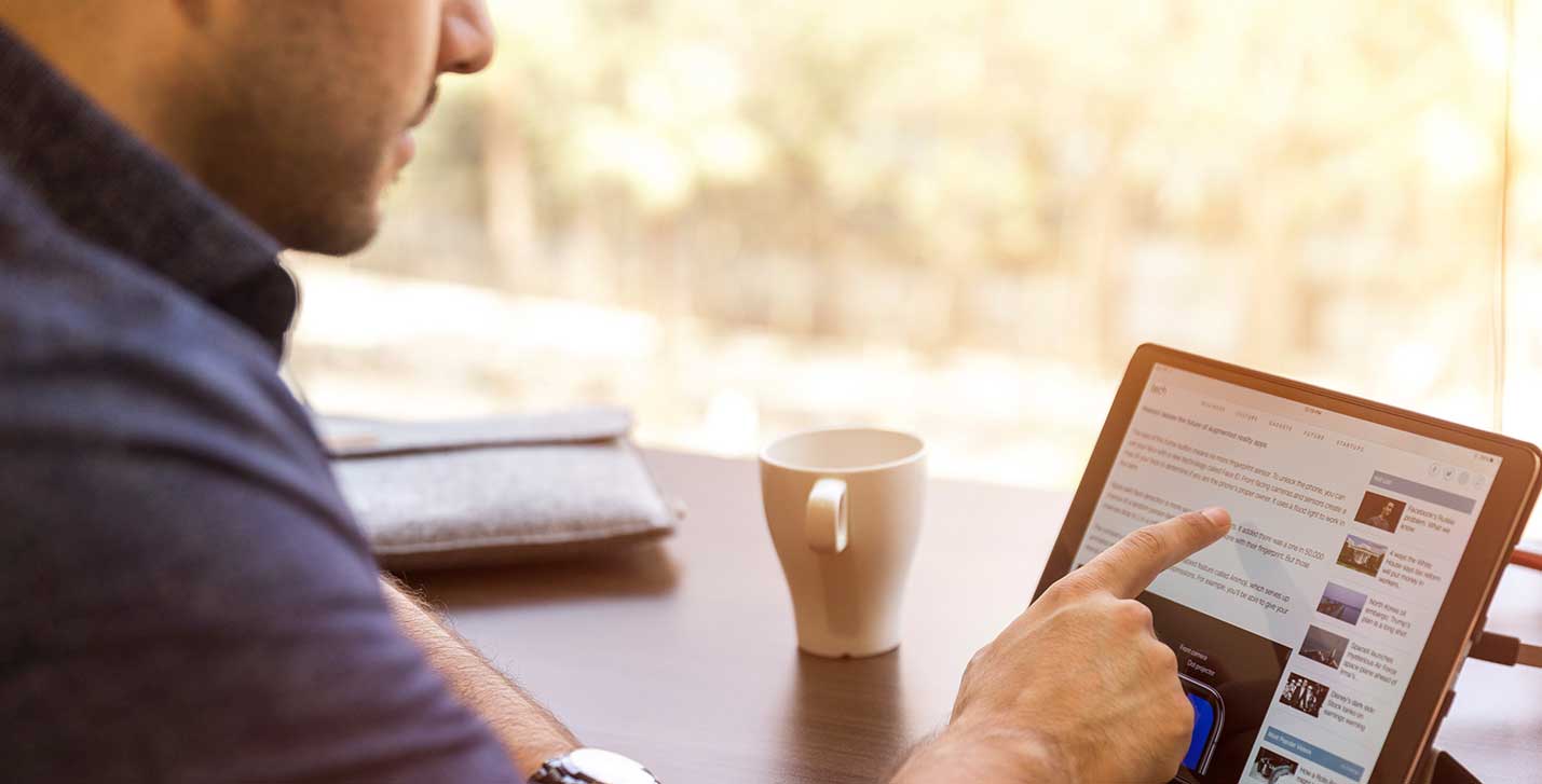 Technology Innovation slider image of a man using a tablet