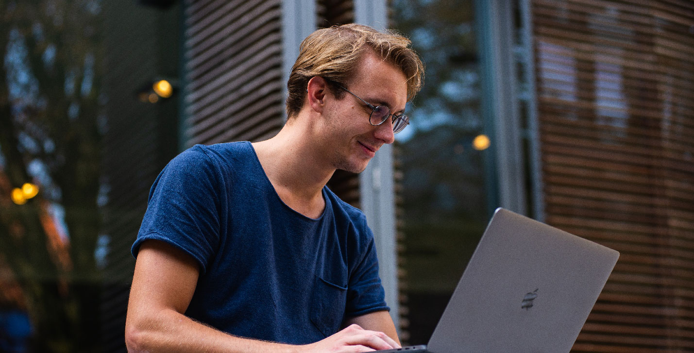 Technology Innovation slider image of a man on a laptop