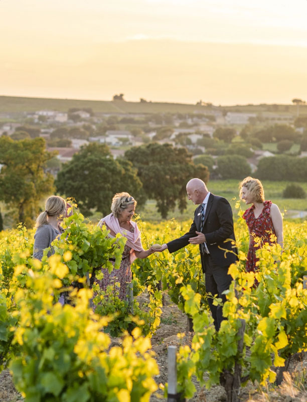 Explore Our Brands Image Section Image of 4 People standing in a field