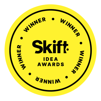 Yellow circular badge with "Skift Idea Awards" in the center, surrounded by the word "Winner" repeated four times around the edge. A subtle nod to Sustainability Awards echoes through its design.