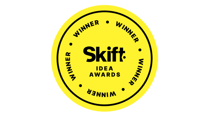 Yellow circular badge with "Skift Idea Awards" in the center, flanked by "Winner" repeated four times around the edge, celebrating innovation as brightly as sustainability awards honor eco-friendly achievements.